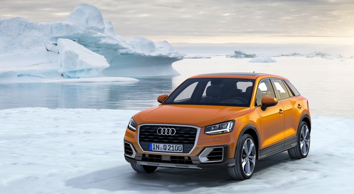Orange Audi Q2 TFSI quattro in snow with icebergs
