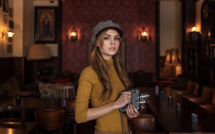 Woman with vintage camera by Maxim Guselnikov