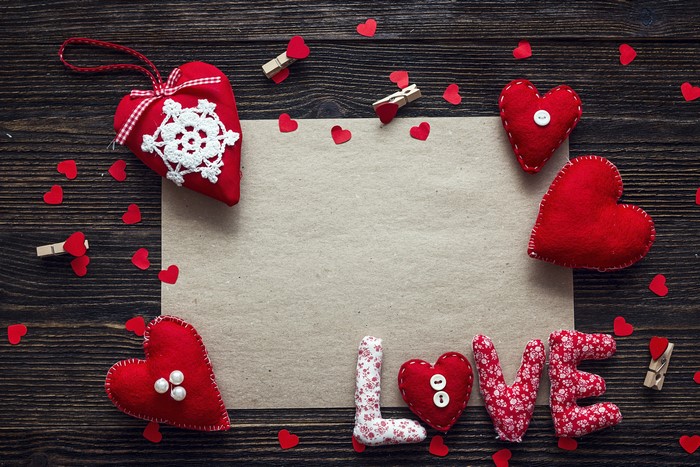 Valentine's Day hearts and love letters on wooden background