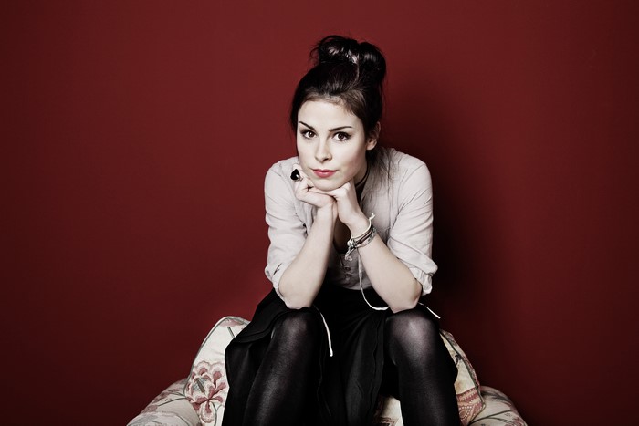 Lena Meyer-Landrut sitting on a chair