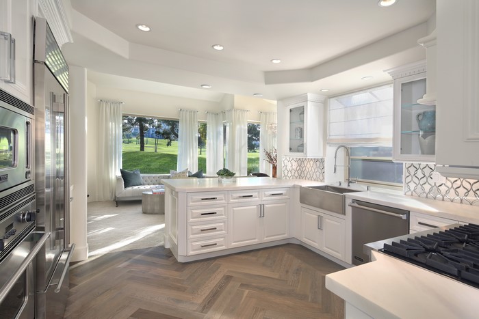Modern White Kitchen with Island and Living Area