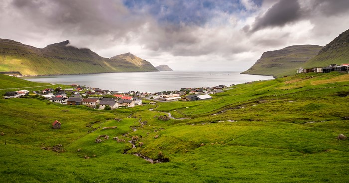Faroe Islands village with mountains and bay