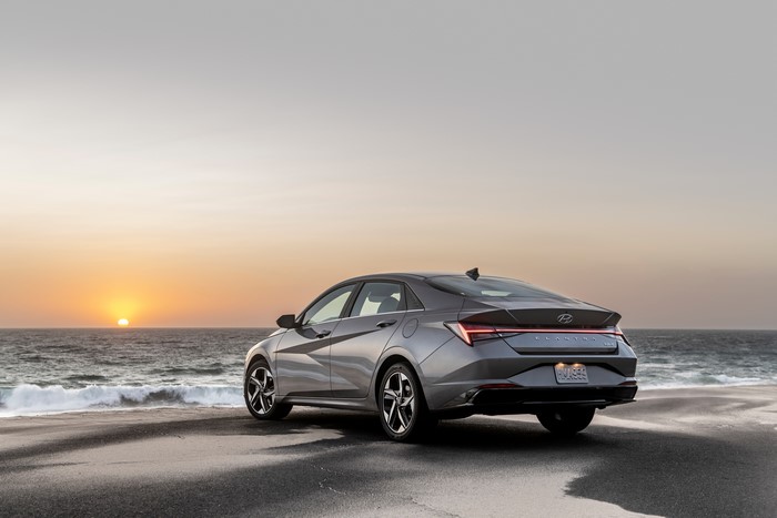 Grey Hyundai Elantra Hybrid on a Beach at Sunset