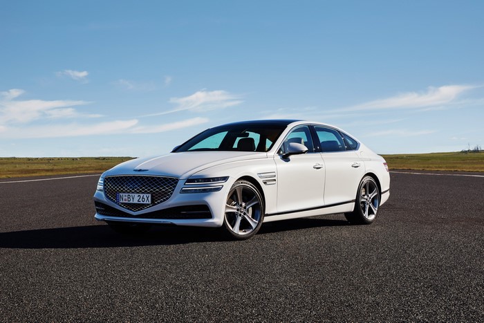 White Genesis G80 3.5T AWD sedan on a road
