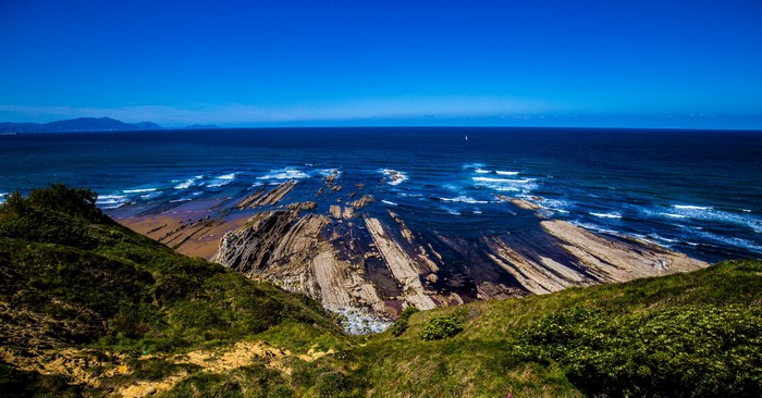 Coastline with rock formations and ocean in Sopela, Spain