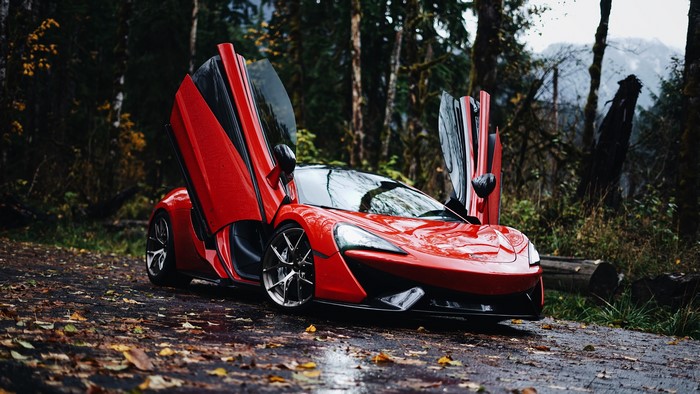 Red McLaren 570S with Doors Open in Forest