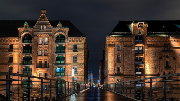 Warehouse district buildings and bridge at night in Hamburg