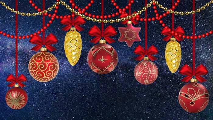 Christmas ornaments and pine cones hanging on a starry background