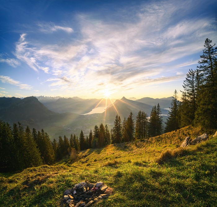 Sunrise over Swiss Alps with Lake and Forest