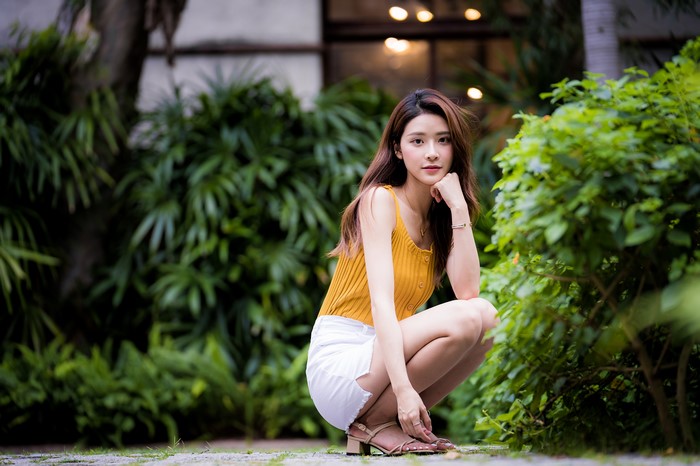 4K Asian Woman Sitting with Brown Hair