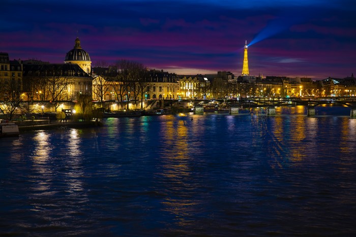 Paris at night with Eiffel Tower and Seine River