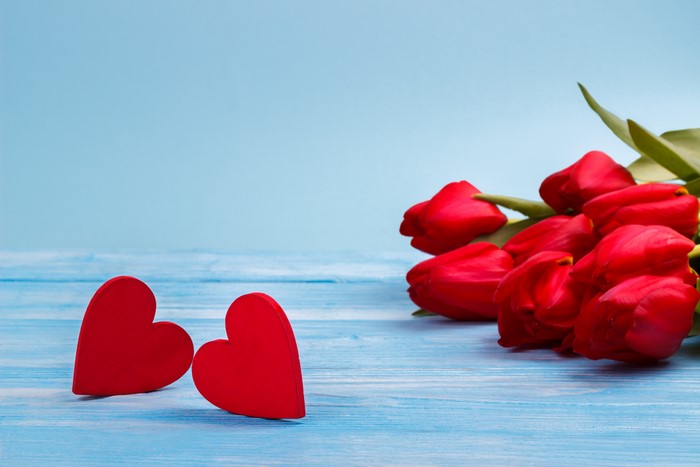 Red Tulips and Hearts on Blue Wooden Table