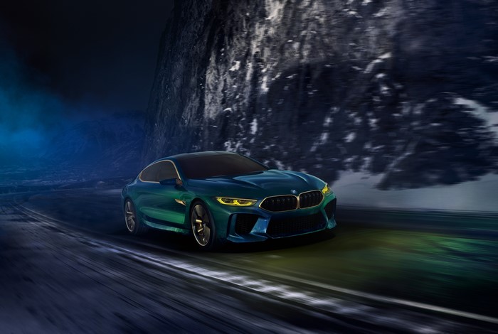 BMW 2018 M8 Gran Coupe Concept driving on a road
