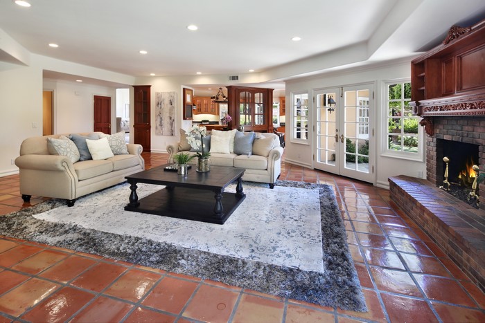 Living room with sofas, coffee table, and fireplace
