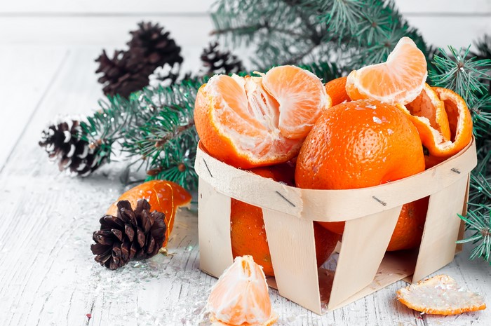 4K Mandarines and Pine Cones with Christmas Tree Branches