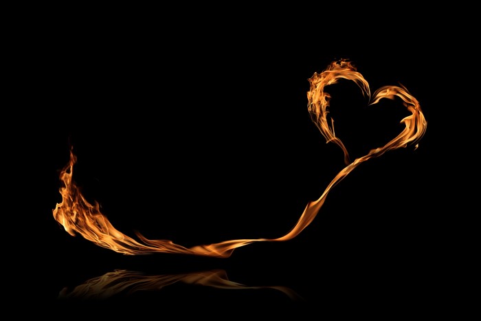 Fire heart shape on black background