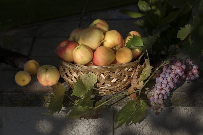 Grapes and Apples in a Wicker Basket