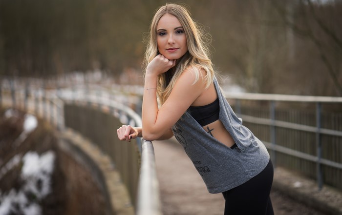Christina posing on a bridge