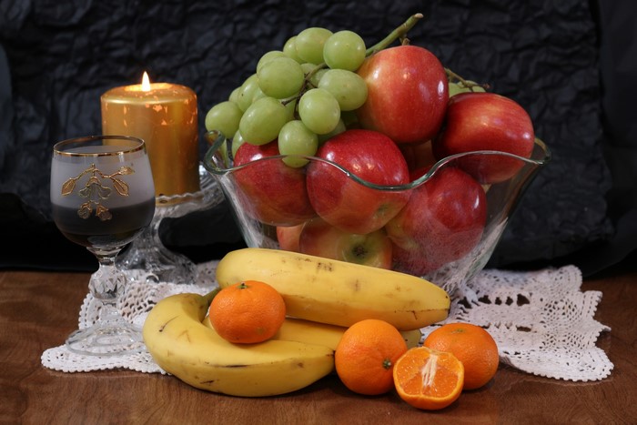 Still life with fruit, candle, and wine glass