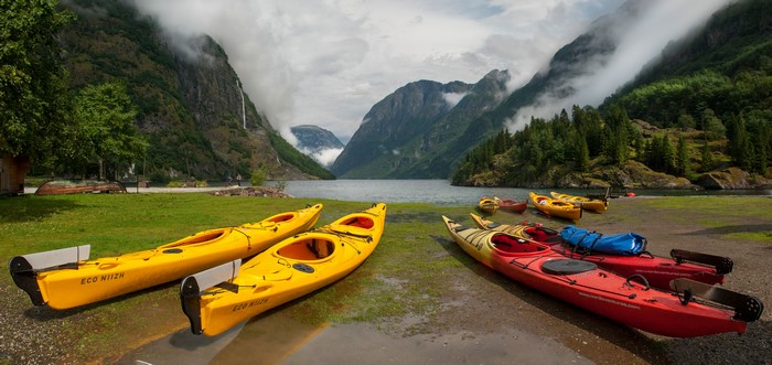 Kayaks on the shore of a Norwegian fjord
