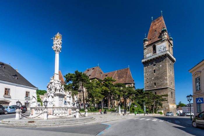 Perchtoldsdorf town square with plague column and clock tower