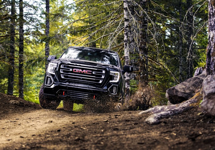 Black 2019 GMC Sierra AT4 Crew Cab driving off-road