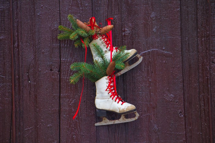 Christmas decoration with ice skates and pine cones