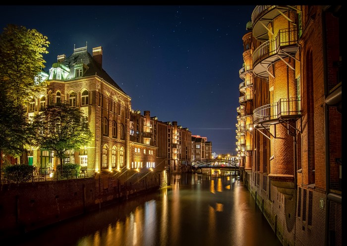 Hamburg Germany night canal with historic buildings
