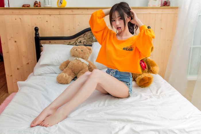 4K Asian Girl Sitting on Bed with Teddy Bears