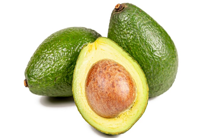 Three avocados on a white background
