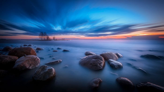 Stones on the coast of Finland at sunset