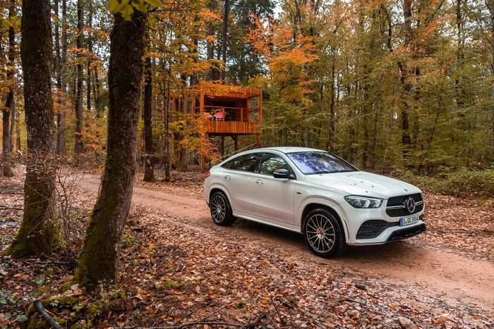 White Mercedes-Benz GLE Coupe in Autumn Forest