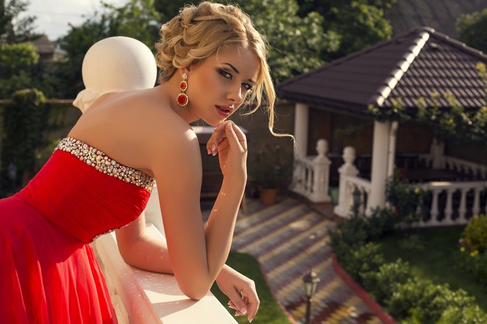 Blonde girl in red dress with earrings