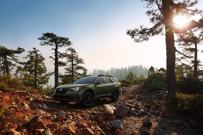 Green Subaru Outback Onyx Edition XT on rocky terrain