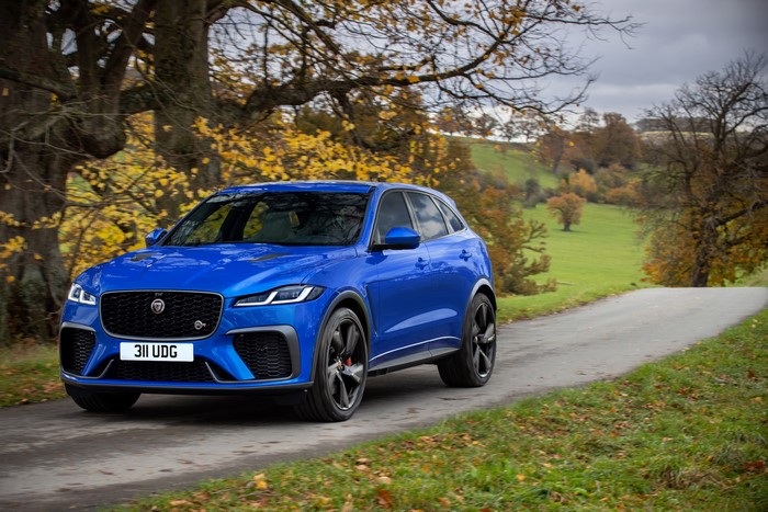 Blue Jaguar F-Pace SVR driving on a road