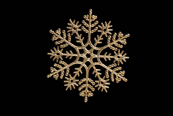 Golden Snowflake on Black Background