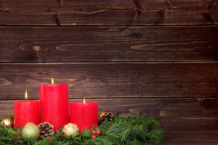 Christmas Advent Candles on a Wooden Background