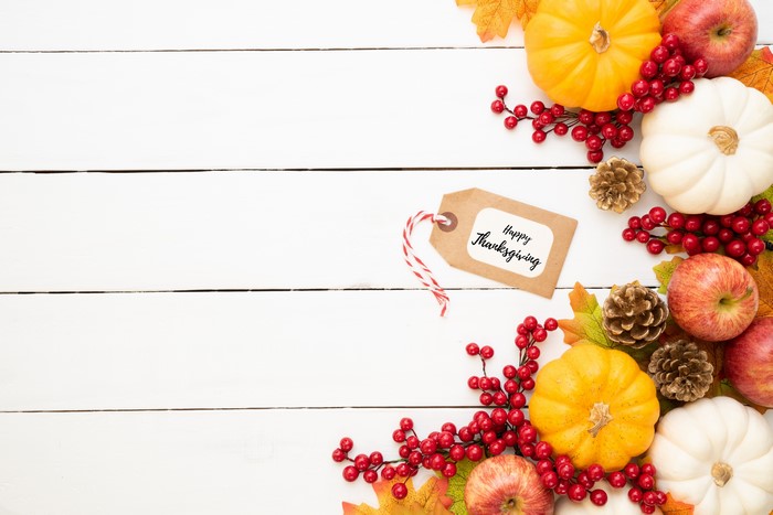 Thanksgiving decoration with pumpkins, apples, and berries