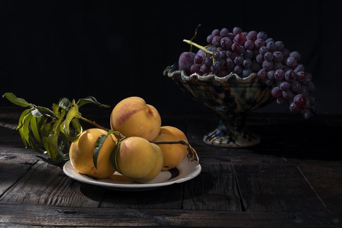 Grapes and Peaches on a Plate with Branches