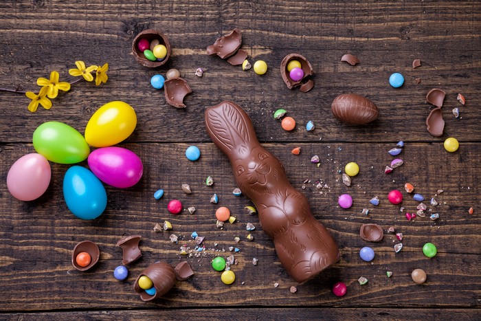 Easter chocolate bunny and eggs on wood