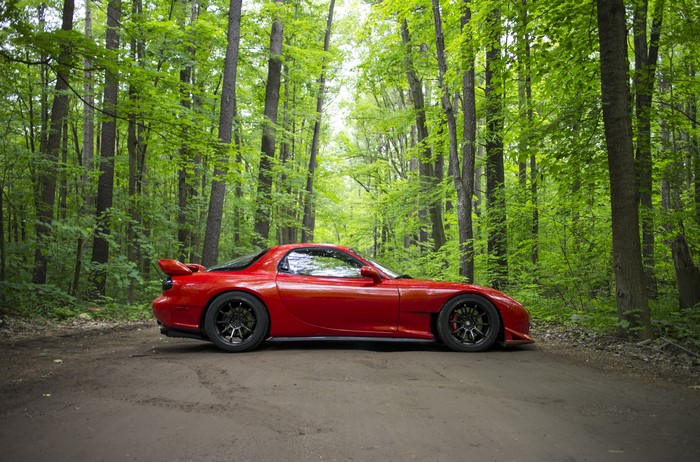Red Mazda RX-7 in Forest