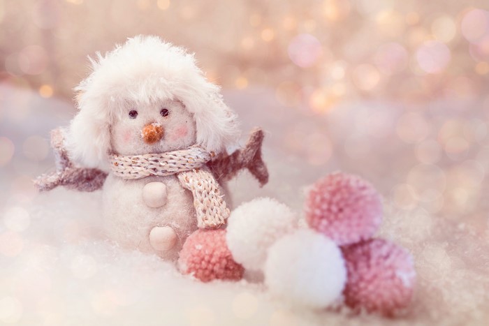 Snowman toy with scarf and pom-poms