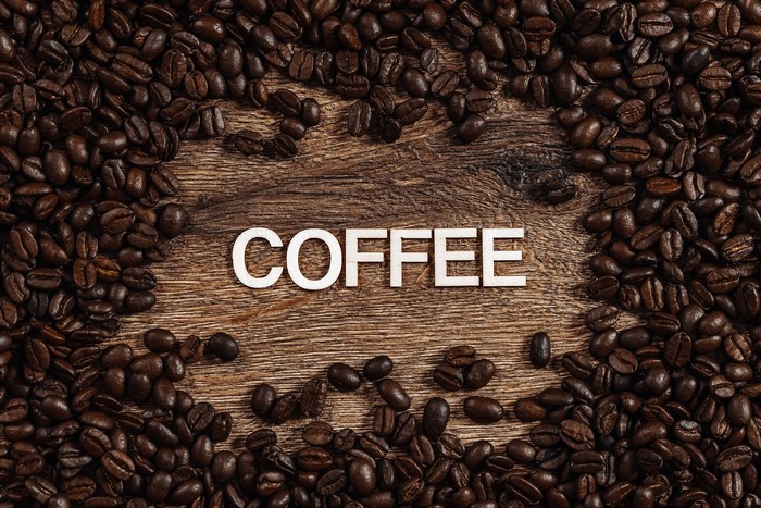 Coffee Beans on Wood with Word Coffee