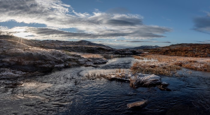 Frosty landscape with river and clouds in Suldal, Norway