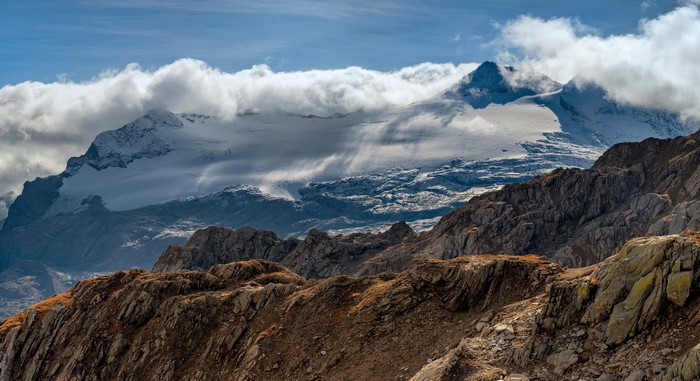 Snow-capped mountains and clouds in Ticino, Switzerland