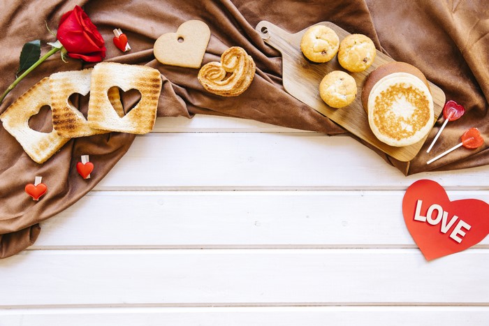 Valentine's Day breakfast with heart-shaped toast and muffins