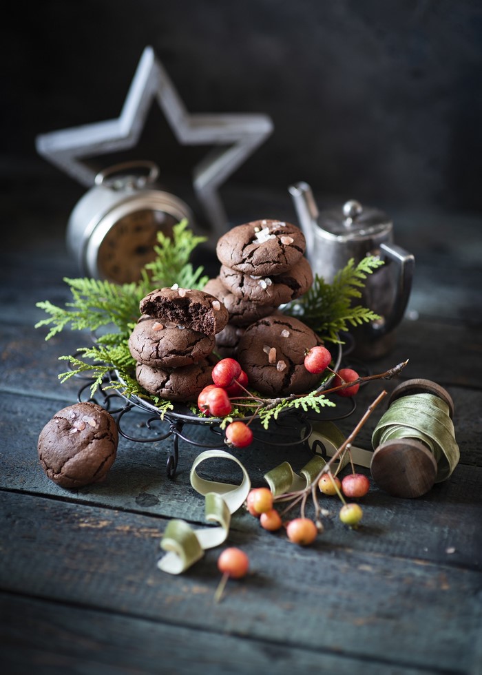 Chocolate cookies with berries and festive decorations