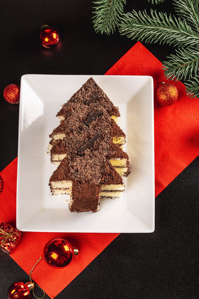 Christmas tree cake slices with chocolate and ornaments