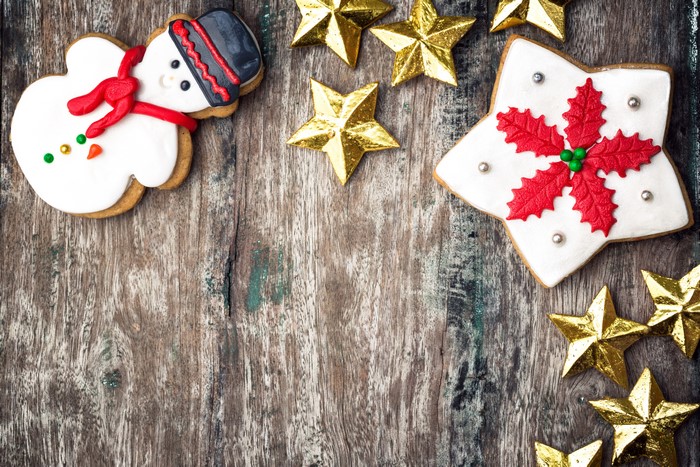 Christmas cookies and star decorations on wood
