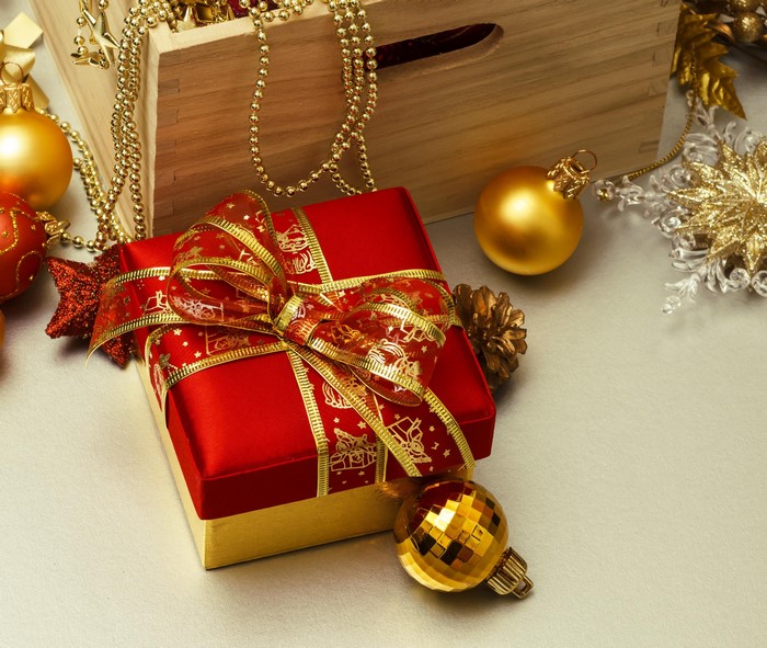 Christmas gift box with ornaments and beads